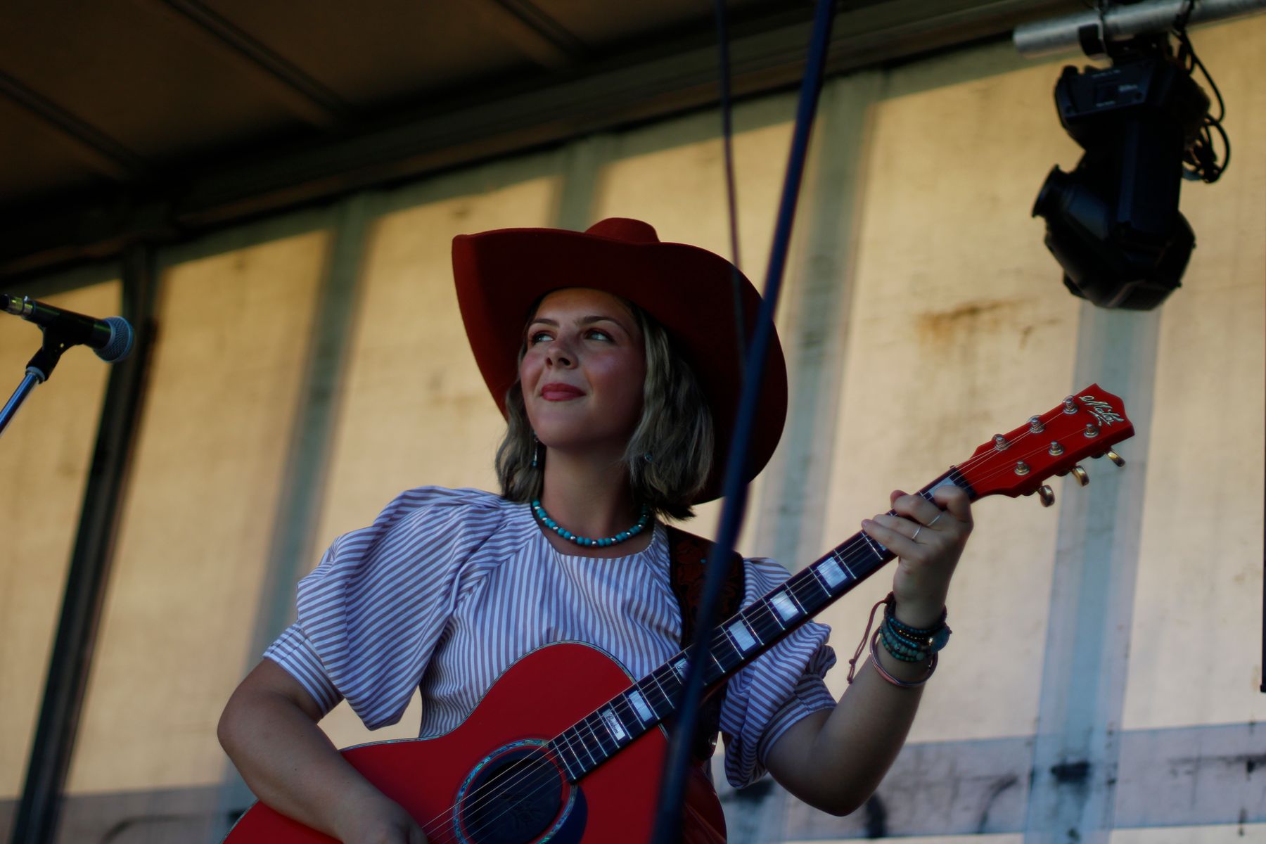 Ruby Holden performing on outdoor stage