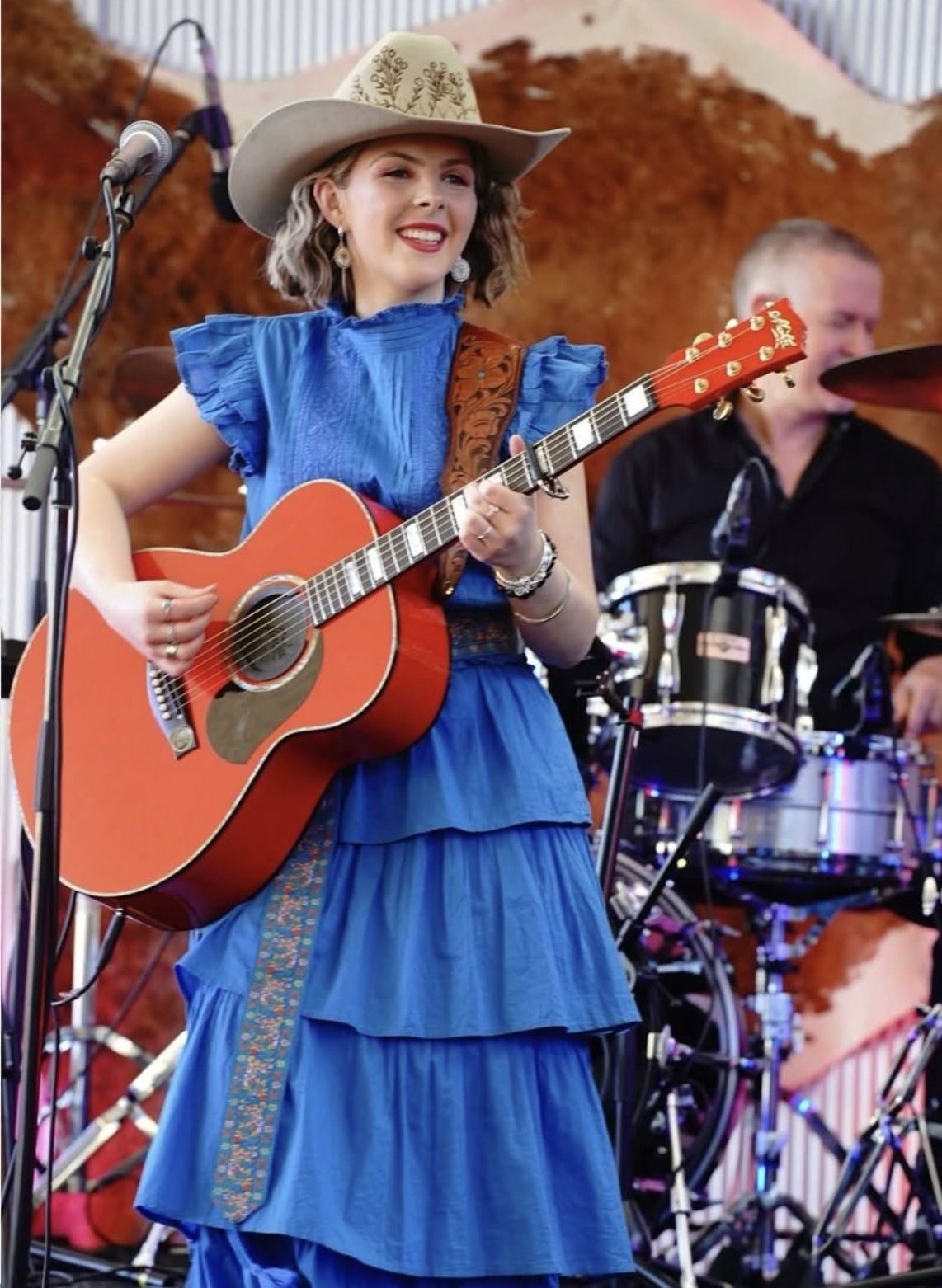 Ruby Holden performing in a blue dress