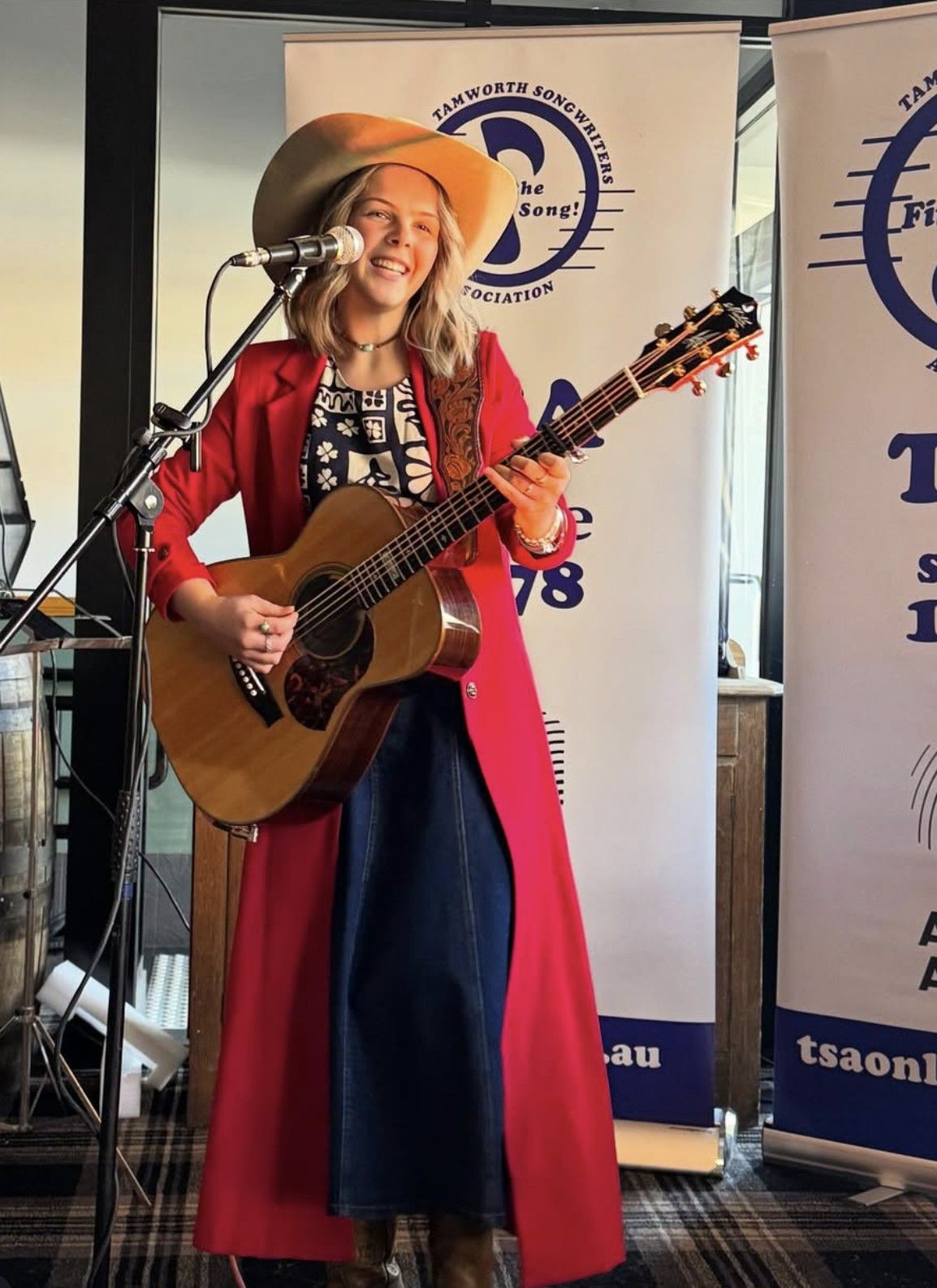 Ruby Holden in red outfit at Tamworth