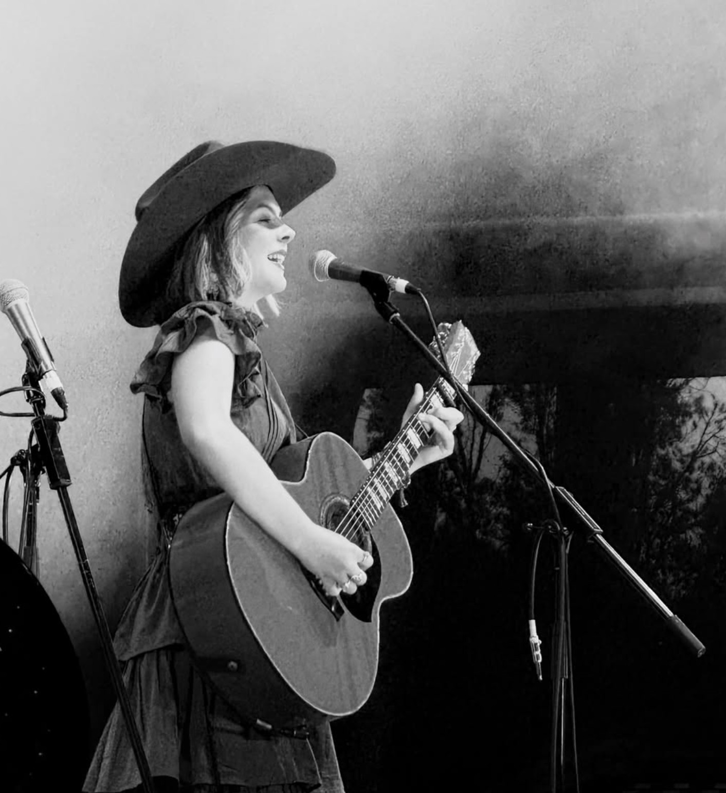 Ruby Holden performing live, black and white